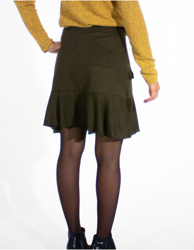 Falda malla 95% poliéster 5% elastano con pompones